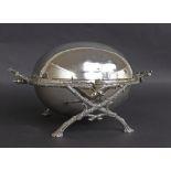 Attractive silver plated revolving breakfast dish, with fitted pierced tray interior upon a