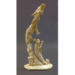 Japanese carved ivory okimono depicting a figure and dragon, Meiji period, 8.75" high