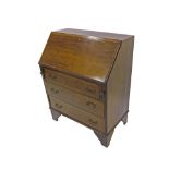 Edwardian mahogany and walnut crossbanded bureau, the fall-front enclosing a segmented interior