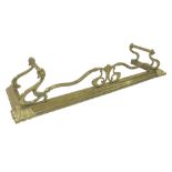 Late Victorian brass fire curb with Art Nouveau type motifs, 54" wide