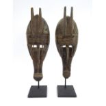 Pair of Bambara tribe marker Mali zoomorphic masks, with antlers and snout, applied sheet metal