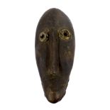 Grure Wobe carved mask, Ivory Coast with applied cow hide to the eyes and chin, 19" long