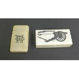 Antique ivory snuff box, the hinged lid etched with an arsenal, 2.75" long; together with a