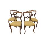 Set of four Victorian rosewood dining chairs, with balloon shaped backs, foliate stuffover seats and