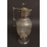 Good Victorian etched glass and silver plated claret jug, the silver plated collar mounted by a lion