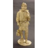 Japanese sectional ivory okimono of a man holding a basket upon his shoulder, signed to base,