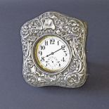 Edwardian silver easel travel watch case pierced with scrolled foliage and acanthus, the hinged