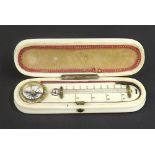 Antique ivory and gold pique work oval box, the hinged lid enclosing a compass and thermometer, 3.5"