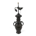 Chinese bronze twin handled lidded baluster vase converted to a lamp, embossed with a band of