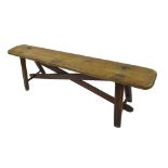 Good antique primitive farmhouse/pig bench, the plank top upon four splayed legs, the top and base