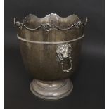 Edwardian silver ice bucket, the wavy rim cast with cherub heads above twin lion head handles, maker