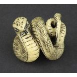 Japanese stained ivory netsuke as a coiled snake, signed, 1.25" high
