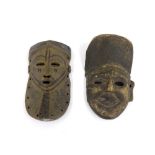 African carved Pende tribal mask, 11" long; together with a further carved Nepalese wooden mask,