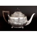 George III silver serpentine teapot with later Victorian chasing of flowers and acanthus, with