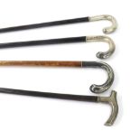 Four various white metal handled walking canes (4)