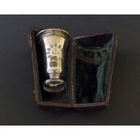 Travelling Victorian communion silver leather cased matched cup and paten, each engraved with IHS