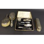 Vintage cased silver vanity set with manicure items etc; together with three silver dressing