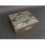 Edwardian silver leather jewellery box applied with silver floral foliage, the hinged lid