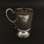 Victorian silver pedestal mug with fancy C-scroll handle, the bowl engraved with panels of roses and