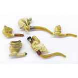 Two carved Meerschaum pipes depicting ladies; together with three female bust Meerschaum pipes (5)