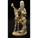 Japanese ivory okimono depicting a father and son with a stag, Meiji period, 7" high (a.f)