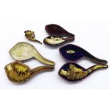 Four assorted carved Meerschaum pipes depicting cattle and wildlife (three cased) (4)