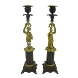 Pair of bronze and ormolu figural candlesticks modelled as classically dressed gentleman and his