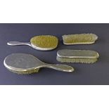 Early 20th century silver four piece dressing set to include four various brushes, maker CD,