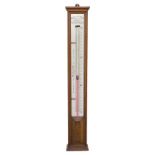 Negretti & Zambra glycerine and mercury long range barometer, within a light oak case, 43.5" high