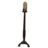 Mahogany barometer stand, with a mercury paper scale upon a reeded column with tripod supports,