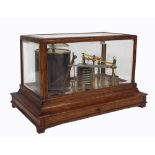 Oak cased barograph, with a frieze drawer containing used record sheets within a bevelled four glass