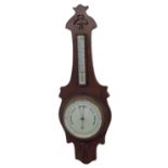 Art Nouveau oak wall barometer/thermometer, the 8" dial signed Mann, Gloucester within a stylised
