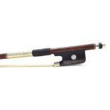 Silver mounted violin bow stamped ...a Paris, the stick round, the ebony frog inlaid with pearl eyes