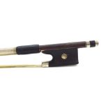 Silver mounted violin bow, indistinctly branded, the stick octagonal, the ebony frog inlaid with