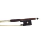 Silver mounted violin bow stamped Simon Paris, the stick round, the ebony frog inlaid with silver