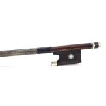 German silver mounted violin bow stamped Dodd, the stick round, the ebony frog inlaid with silver