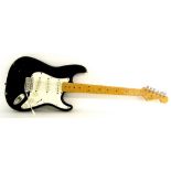 1990 Fender Stratocaster electric guitar, probably Japanese, ser. no. G036295, black finish with
