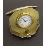 Silver cased octagonal compact travel watch, the gilt interior with a circular white dial with