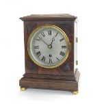 Oak single fusee mantel clock, the 5.25" silvered dial within a stepped case with carved
