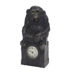 Novelty automaton clock timepiece in the form of a monkey with moving eyes and mouth, reading a book