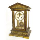 Impressive bronze four glass two train mantel clock striking on a bell, the 4" dial with recessed