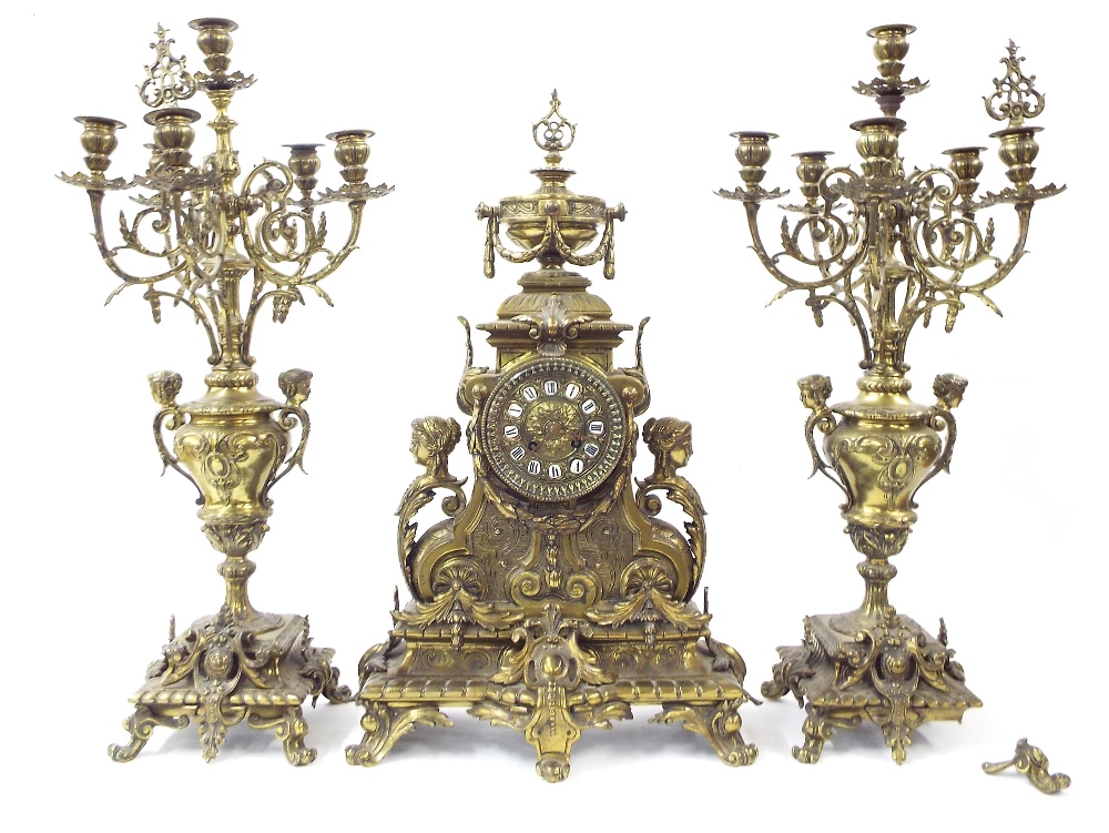 French gilt metal and porcelain mounted two train mantel clock garniture, the movement with