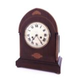Mahogany inlaid lancet two train mantel clock striking on a gong, the 6.25" silvered dial within a