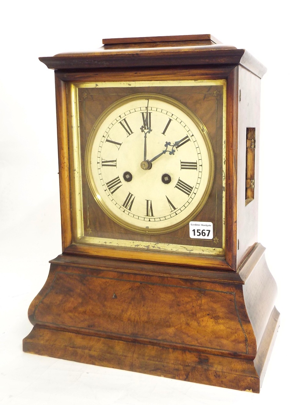 Black Forest walnut double fusee mantel clock striking on a gong, the 6.5" painted circular dial