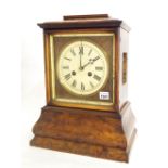 Black Forest walnut double fusee mantel clock striking on a gong, the 6.5" painted circular dial