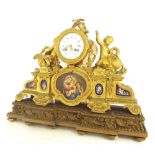 French gilt metal and porcelain panelled two train mantel clock striking on a bell, the 4"