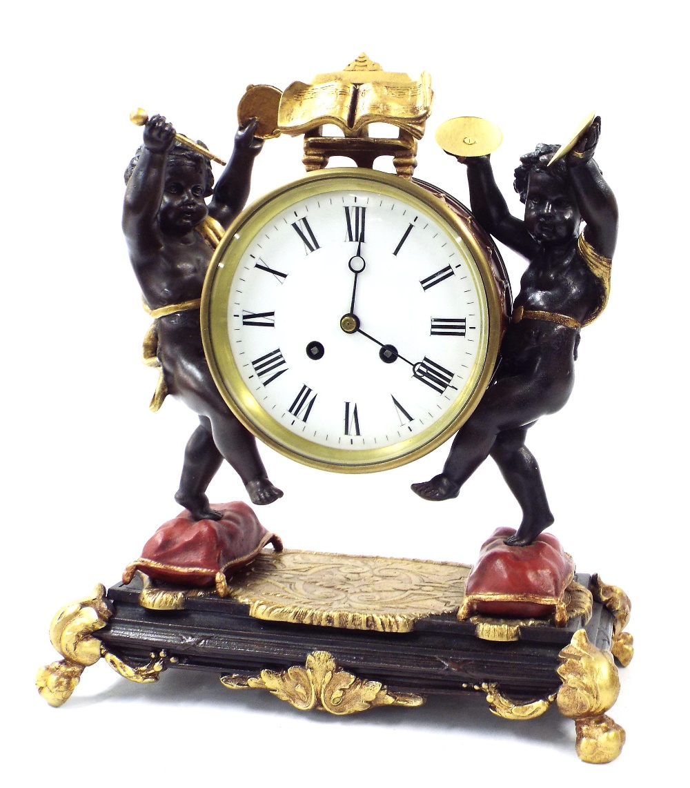 Decorative novelty two train mantel clock, the 5" white dial within a musical drum casing attended