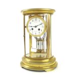 French brass and four glass two train oval mantel clock, the movement with outside countwheel