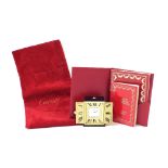 Cartier small alarm clock timepiece, the rectangular dial signed Cartier and enclosed by two