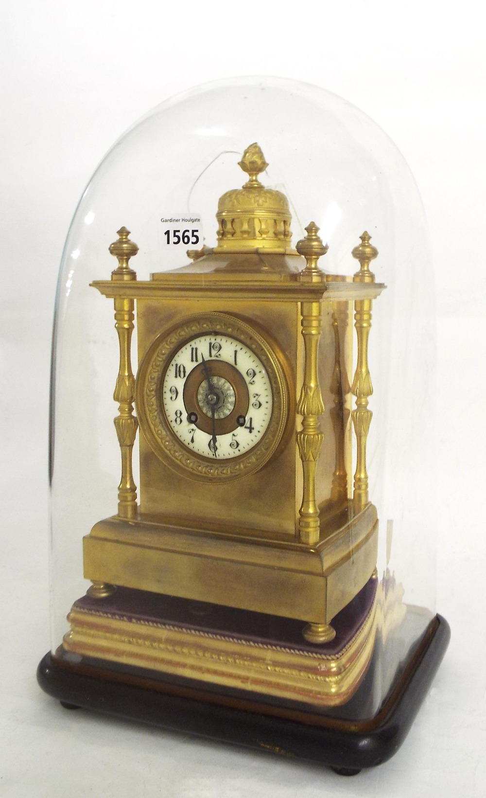 French brass two train mantel clock striking on a gong, the 3.25" cream chapter ring enclosing a